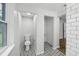 Bathroom with white subway tile, modern tile floors and updated vanity at 1834 Willie Mays Pkwy, Orlando, FL 32811