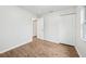 Bright bedroom with wood-look flooring and a large closet, offering ample storage space at 1834 Willie Mays Pkwy, Orlando, FL 32811