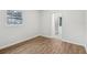 Bedroom featuring wood-look floors, large window and light paint at 1834 Willie Mays Pkwy, Orlando, FL 32811
