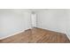 Bright bedroom with wood-look flooring and a large closet, offering ample storage space at 1834 Willie Mays Pkwy, Orlando, FL 32811