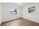 Bedroom featuring wood-look floors, large windows and light paint at 1834 Willie Mays Pkwy, Orlando, FL 32811