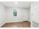 Bedroom with light walls, wood-look floors and natural light at 1834 Willie Mays Pkwy, Orlando, FL 32811