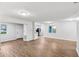 Spacious living area boasts wood floors and a view into the kitchen creating an inviting and airy atmosphere at 1834 Willie Mays Pkwy, Orlando, FL 32811