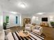 Bright living room with new flooring, neutral colors, and stylish furniture at 1834 Willie Mays Pkwy, Orlando, FL 32811