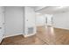Open-concept living area with sleek wood floors offering a seamless transition throughout the home at 1834 Willie Mays Pkwy, Orlando, FL 32811