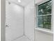 Shower with white subway tile surround and a hexagon tile floor at 1834 Willie Mays Pkwy, Orlando, FL 32811