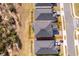 View the surrounding neighborhood of this property from above, showcasing the roof and nearby streets at 187 Aces High Ln, Davenport, FL 33896