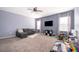 Spacious bonus room with carpeting, ceiling fan, and plenty of space for activities at 187 Aces High Ln, Davenport, FL 33896
