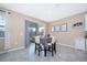 Cozy breakfast nook with a sliding glass door to the lanai and a modern wine rack at 187 Aces High Ln, Davenport, FL 33896