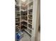 Well-organized pantry with lots of shelving for food and supplies at 187 Aces High Ln, Davenport, FL 33896