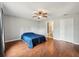Large bedroom with wood floors, a ceiling fan, closet and bathroom entrance at 25 Maple Crse, Ocklawaha, FL 32179