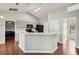 Open floor plan kitchen with an eat-in bar, black appliances, and light gray cabinetry at 25 Maple Crse, Ocklawaha, FL 32179