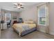 A primary bedroom with a queen bed and a ceiling fan at 31746 Red Tail Blvd, Sorrento, FL 32776