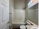 Bathroom with a shower-tub combo and vanity sink with overhead lighting at 324 Anchovie Ct, Kissimmee, FL 34759