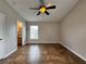 Spacious bedroom with tile floors, a ceiling fan, and view to bathroom at 324 Anchovie Ct, Kissimmee, FL 34759