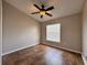 Bedroom with tile floors, ceiling fan and natural light from a window at 324 Anchovie Ct, Kissimmee, FL 34759