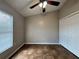 Bedroom features tile floors, a ceiling fan, a window, and a closet at 324 Anchovie Ct, Kissimmee, FL 34759