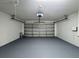Spacious two-car garage has ample space for vehicles and storage at 324 Anchovie Ct, Kissimmee, FL 34759