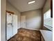 Eat-in kitchen features tile floors, side-by-side refrigerator, and view of backyard at 324 Anchovie Ct, Kissimmee, FL 34759