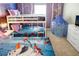 This bedroom features a queen bed, bunkbeds and a TV, all decorated in a cute winter theme at 3432 Lilac Way, Davenport, FL 33897