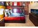 This themed bedroom features bunk beds with detailed designs and a large TV for entertainment at 3432 Lilac Way, Davenport, FL 33897