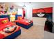 This themed bedroom features two twin beds with colorful decor and playful wall art at 3432 Lilac Way, Davenport, FL 33897