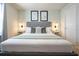 This elegant bedroom features a king-sized bed, a TV, and neutral decor, perfect for relaxation at 3432 Lilac Way, Davenport, FL 33897