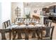 Open dining room with an ornate table setting, with the kitchen visible in the background at 3432 Lilac Way, Davenport, FL 33897