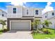 Beautiful two-story home with stone accents, well-manicured lawn, and a spacious two-car garage at 3432 Lilac Way, Davenport, FL 33897