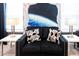 Stylish game room with a comfy couch, modern lamps, and Star Wars themed decor at 3432 Lilac Way, Davenport, FL 33897
