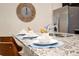 Close-up of kitchen island, featuring granite countertops and ample space for food preparation at 3432 Lilac Way, Davenport, FL 33897