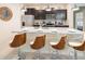 Modern kitchen with granite countertops, stainless steel appliances, and a breakfast bar with seating at 3432 Lilac Way, Davenport, FL 33897