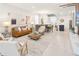 Spacious open-concept living area with a large sectional sofa, dining area, and kitchen at 3432 Lilac Way, Davenport, FL 33897