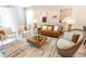Cozy living room with comfortable seating, stylish decor, and plenty of natural light at 3432 Lilac Way, Davenport, FL 33897