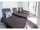 A screened-in patio offers lounge chairs with decorative pillows to relax poolside at 3432 Lilac Way, Davenport, FL 33897