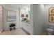 Bright bathroom showcasing double sinks, granite counters, and decorative artwork at 3609 Salvia Ct, Tavares, FL 32778
