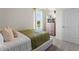 Cozy bedroom featuring a plush bed, neutral tones, and a view of the outdoors at 3609 Salvia Ct, Tavares, FL 32778