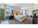Stunning bedroom with large windows, a tufted headboard, and modern furnishings at 3609 Salvia Ct, Tavares, FL 32778