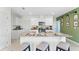 Modern kitchen with granite countertops, stainless steel appliances, and a large center island at 3609 Salvia Ct, Tavares, FL 32778