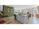 Gourmet kitchen with granite countertops, stainless steel appliances, a center island, and an open layout at 3609 Salvia Ct, Tavares, FL 32778