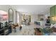 Open-concept living area with dining space, modern decor, neutral colors, and an eat-in kitchen at 3609 Salvia Ct, Tavares, FL 32778