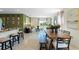 Open-concept living room and dining area with lots of natural light, tile floors, and neutral color scheme at 3609 Salvia Ct, Tavares, FL 32778