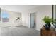 Bright loft space with neutral walls, natural light, and a view of the outdoors at 3609 Salvia Ct, Tavares, FL 32778