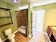 Bright bathroom showcases a tiled shower/bathtub combo with wood look floors at 428 E Orange Ave, Eustis, FL 32726