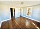This bedroom has wood floors and neutral colored walls at 428 E Orange Ave, Eustis, FL 32726