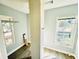 Bedroom with wood look floors and windows providing natural light at 428 E Orange Ave, Eustis, FL 32726