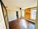 This bedroom has wood floors, three windows and an ensuite bathroom at 428 E Orange Ave, Eustis, FL 32726