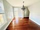 The dining room has hardwood flooring and a decorative chandelier at 428 E Orange Ave, Eustis, FL 32726