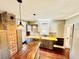 Renovated kitchen featuring butcher block countertops and stainless steel appliances at 428 E Orange Ave, Eustis, FL 32726