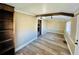 Bright living room with wood floors, beamed ceiling, and space for entertaining at 428 E Orange Ave, Eustis, FL 32726